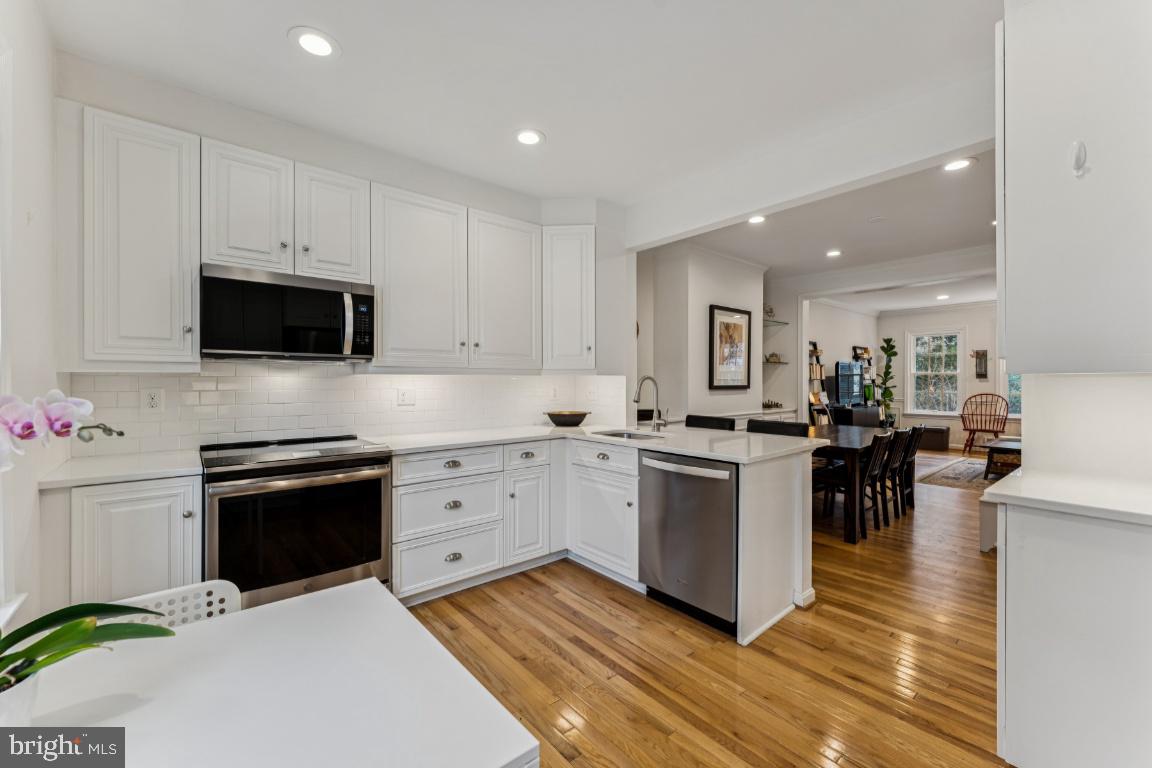 3559 Hamlet Place Chevy Chase, MD 20815 - Photo 2 of 26 a kitchen with sink cabinets and stainless steel appliances