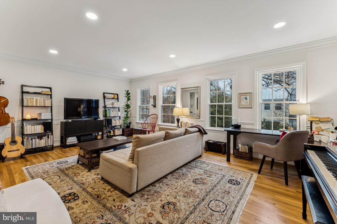 3559 Hamlet Place Chevy Chase, MD 20815 - Photo 8 of 26 a living room with furniture and a flat screen tv