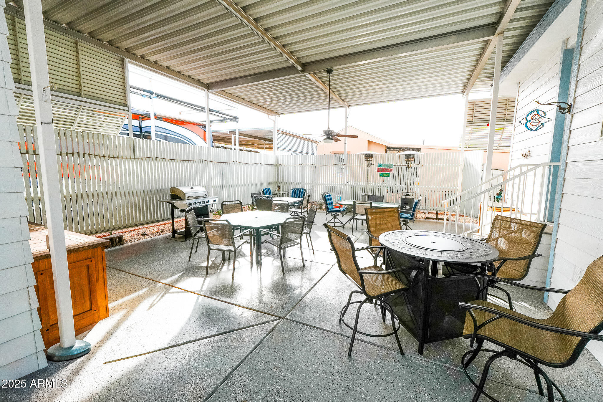 17200 West Bell Road, Unit 915 Surprise, AZ 85374 - Photo 15 of 32 a outdoor dining area with a table and chairs