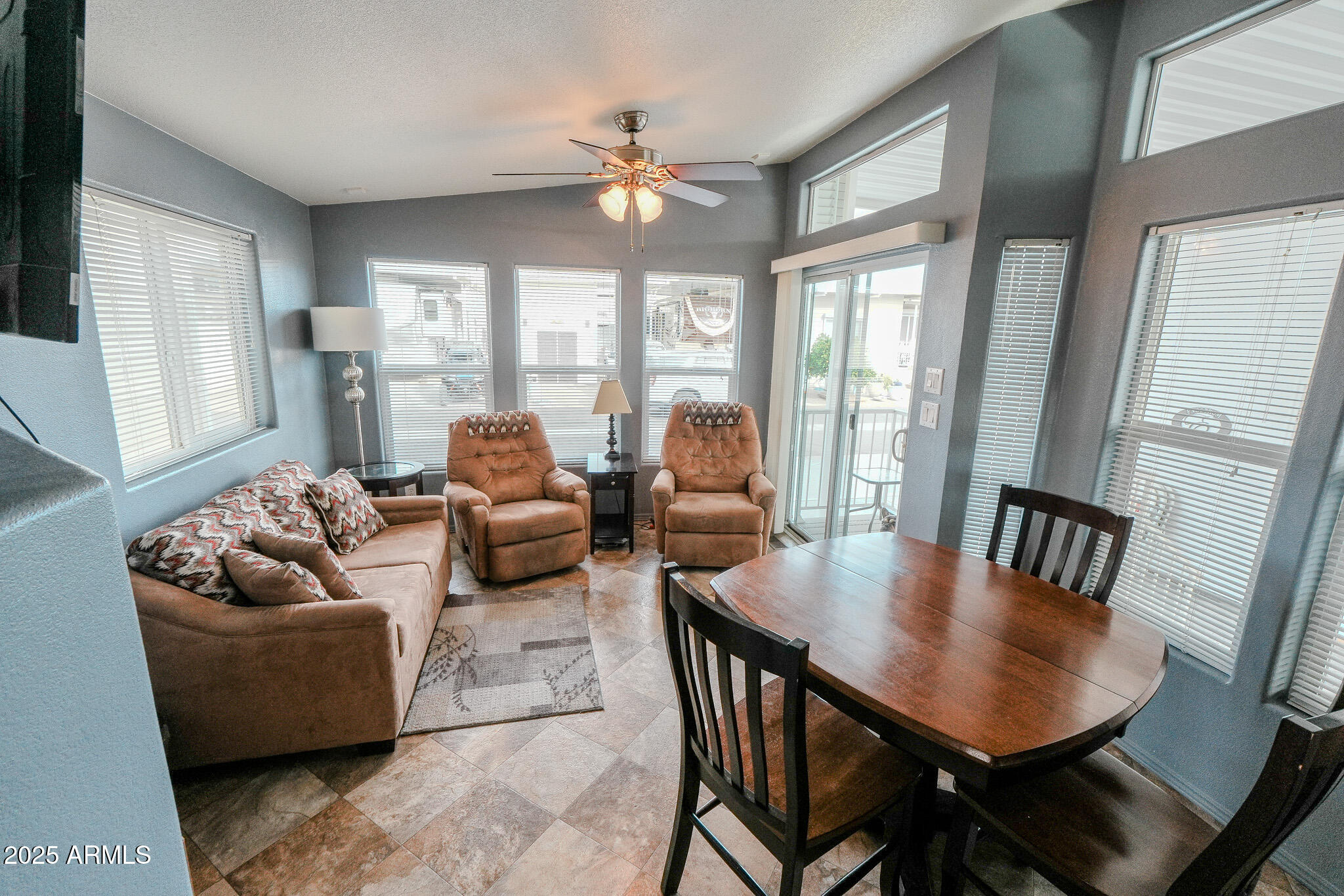 17200 West Bell Road, Unit 915 Surprise, AZ 85374 - Photo 2 of 32 a living room with furniture and a large window
