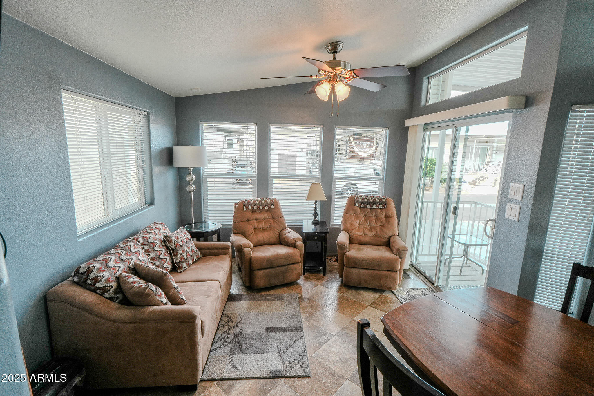 17200 West Bell Road, Unit 915 Surprise, AZ 85374 - Photo 21 of 32 a living room with furniture and a large window