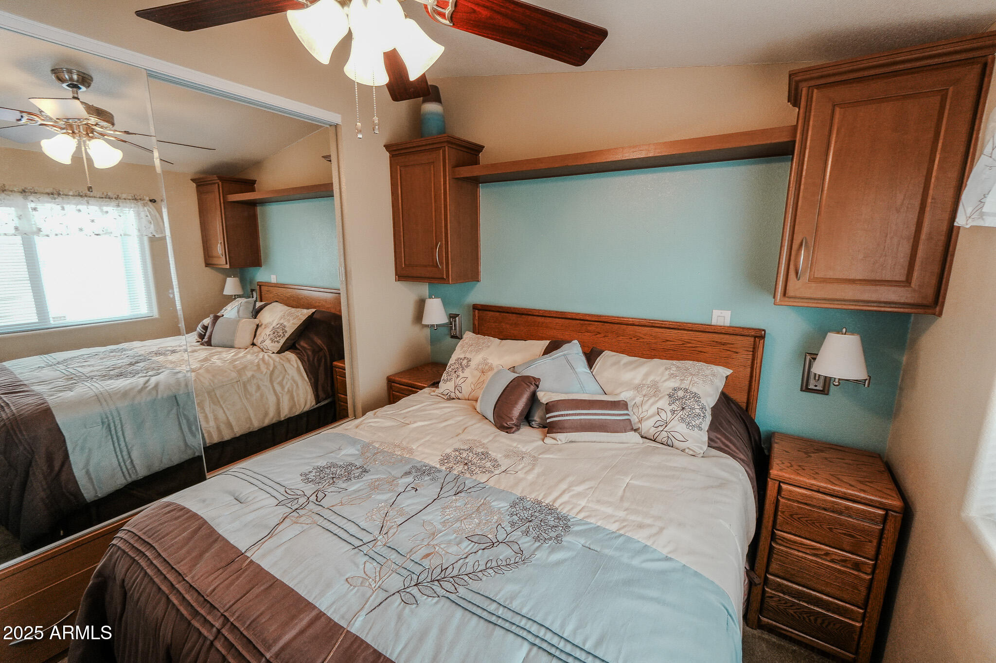 17200 West Bell Road, Unit 915 Surprise, AZ 85374 - Photo 31 of 32 a bedroom with two beds and a dresser