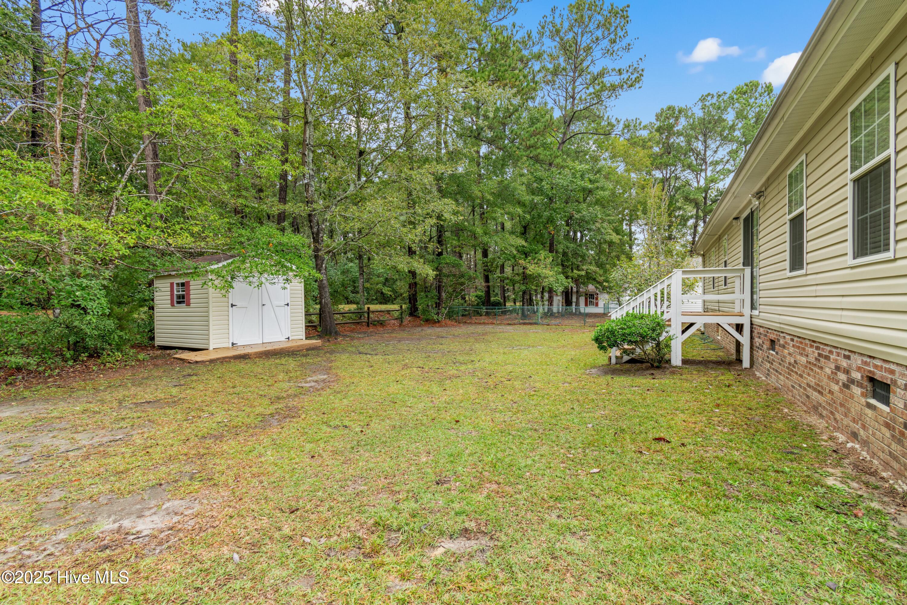 814 Watson Avenue Southwest Calabash, NC 28467 - Photo 32 of 35 back yard and building