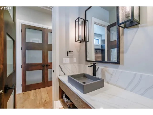 a bathroom with a sink and a mirror