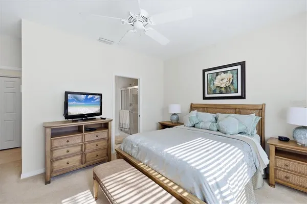 a bedroom with a bed and a mirror