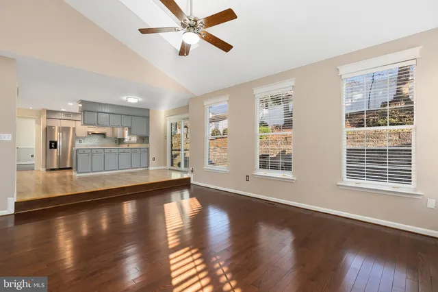 a kitchen with stainless steel appliances granite countertop a stove and cabinets