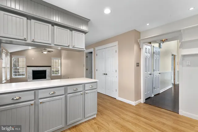 a kitchen with stainless steel appliances a sink stove and cabinets