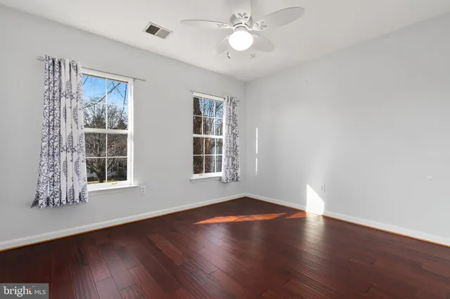 a bathroom with bathtub and window