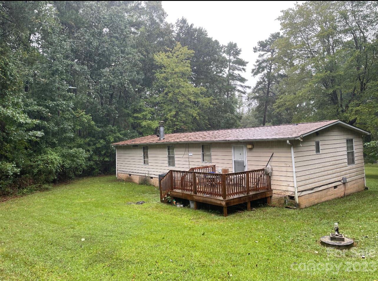 2121 Milton Road Durham, NC 27712 - Photo 11 of 14 a view of a house with a backyard and a patio