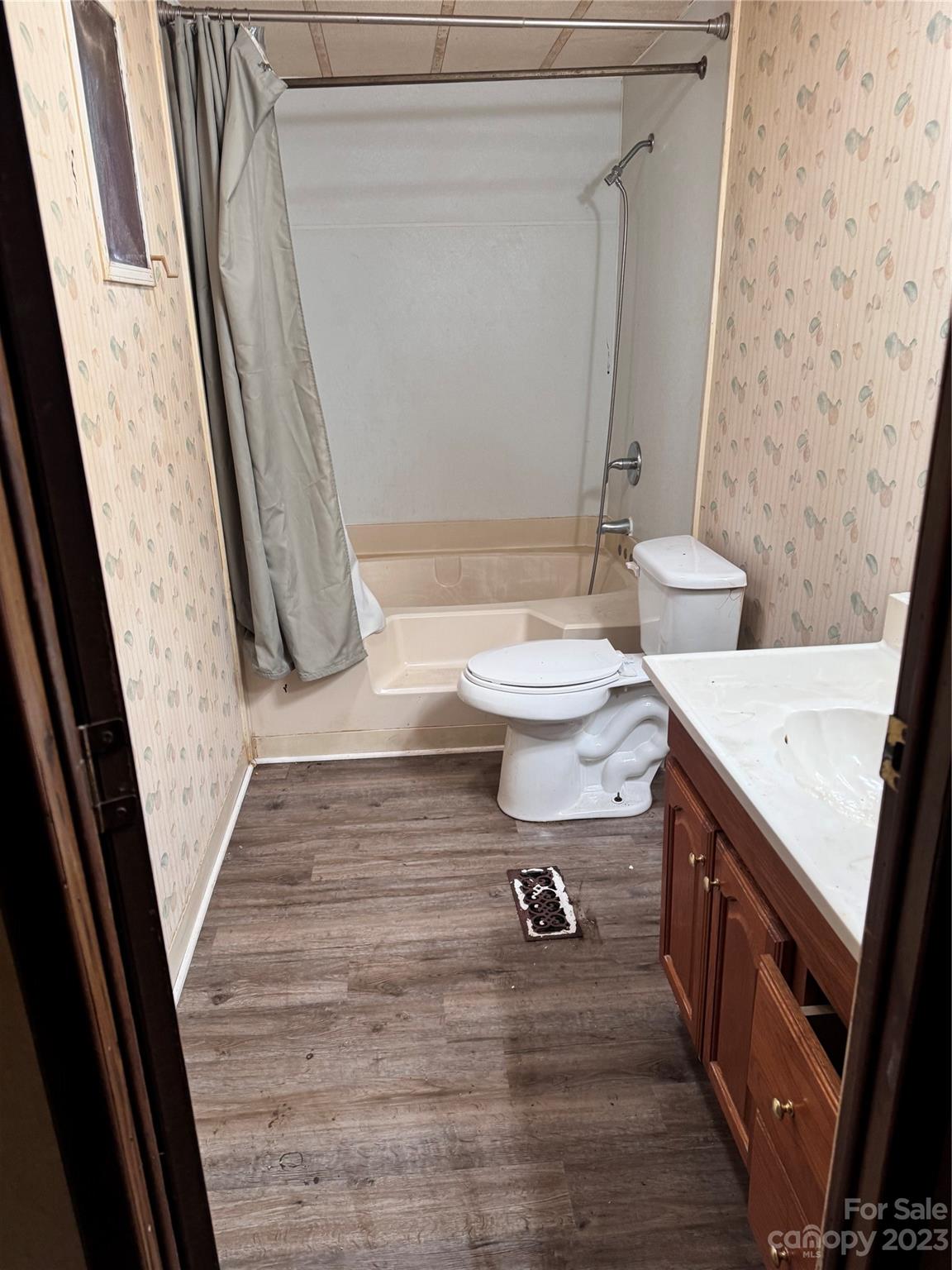 2121 Milton Road Durham, NC 27712 - Photo 6 of 14 a bathroom with a sink a toilet and a shower