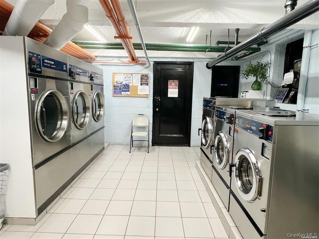 112-19 34th Avenue, Unit F Queens, NY 11368 - Photo 9 of 11 a utility room with dryer and washer