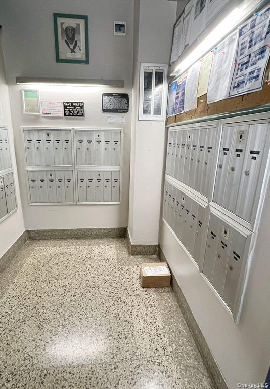 112-19 34th Avenue, Unit F Queens, NY 11368 - Photo 10 of 11 a view of water heater room with stair