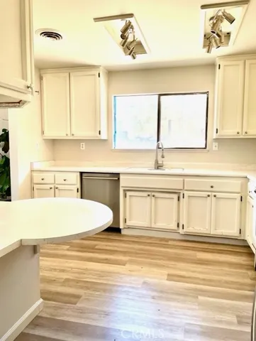 a bathroom with a sink a mirror and a bathtub