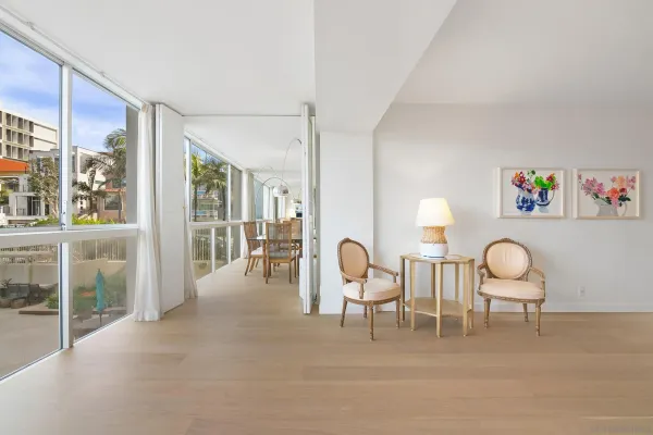 a view of a livingroom with furniture table and chairs