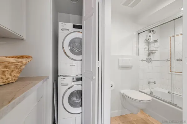 a bathroom with a toilet sink and shower