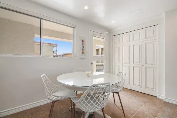 a dining room with furniture and window