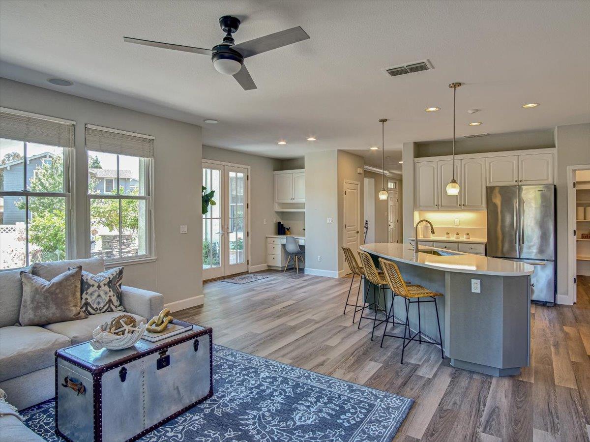 1042 Promenade Street Hercules, CA 94547 - Photo 11 of 60 a living room with furniture wooden floor and a window