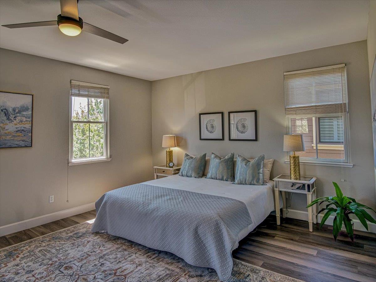 1042 Promenade Street Hercules, CA 94547 - Photo 14 of 60 a bedroom with a bed and a potted plant