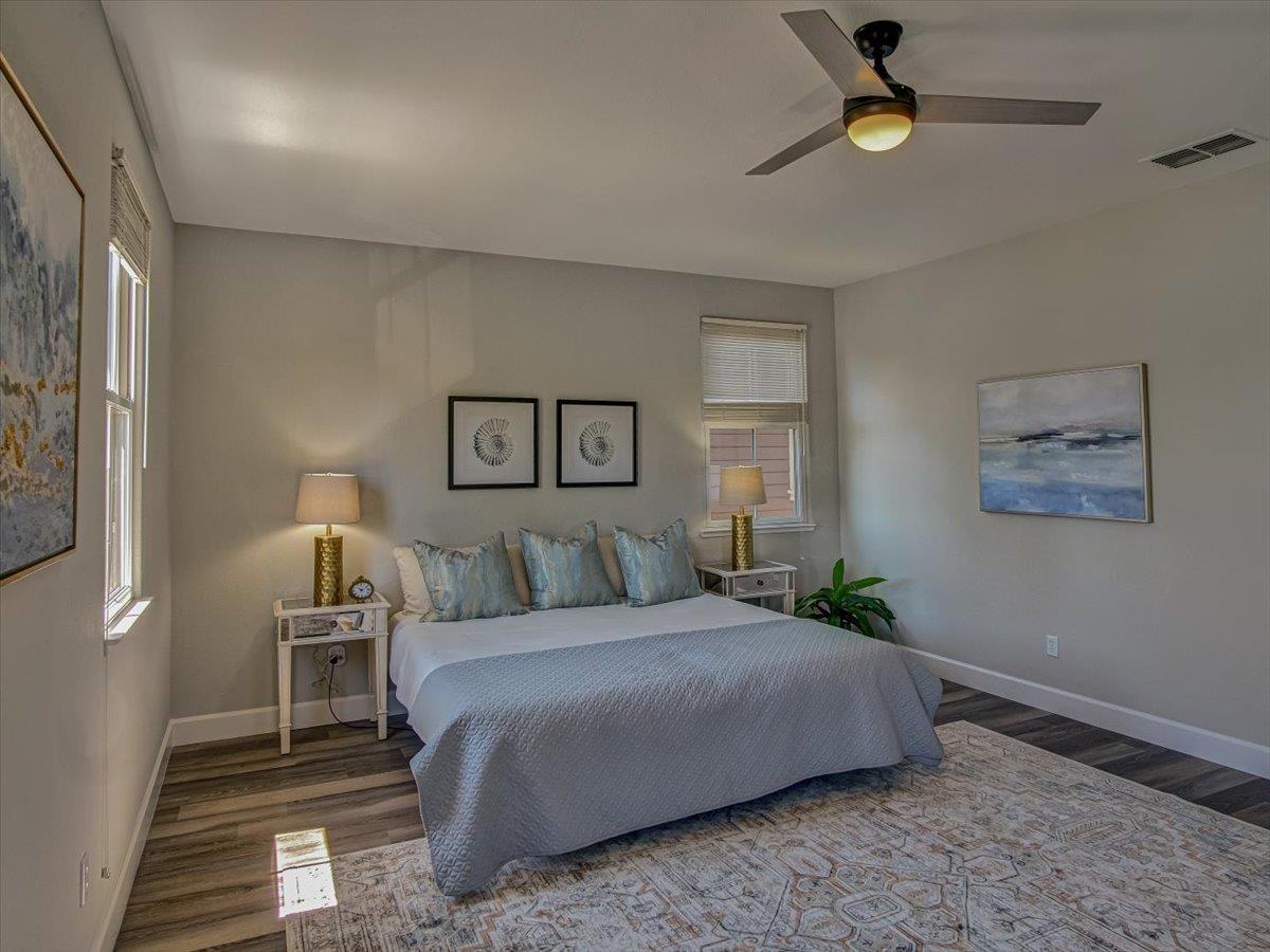 1042 Promenade Street Hercules, CA 94547 - Photo 16 of 60 a bedroom with a bed and a lamp on dresser