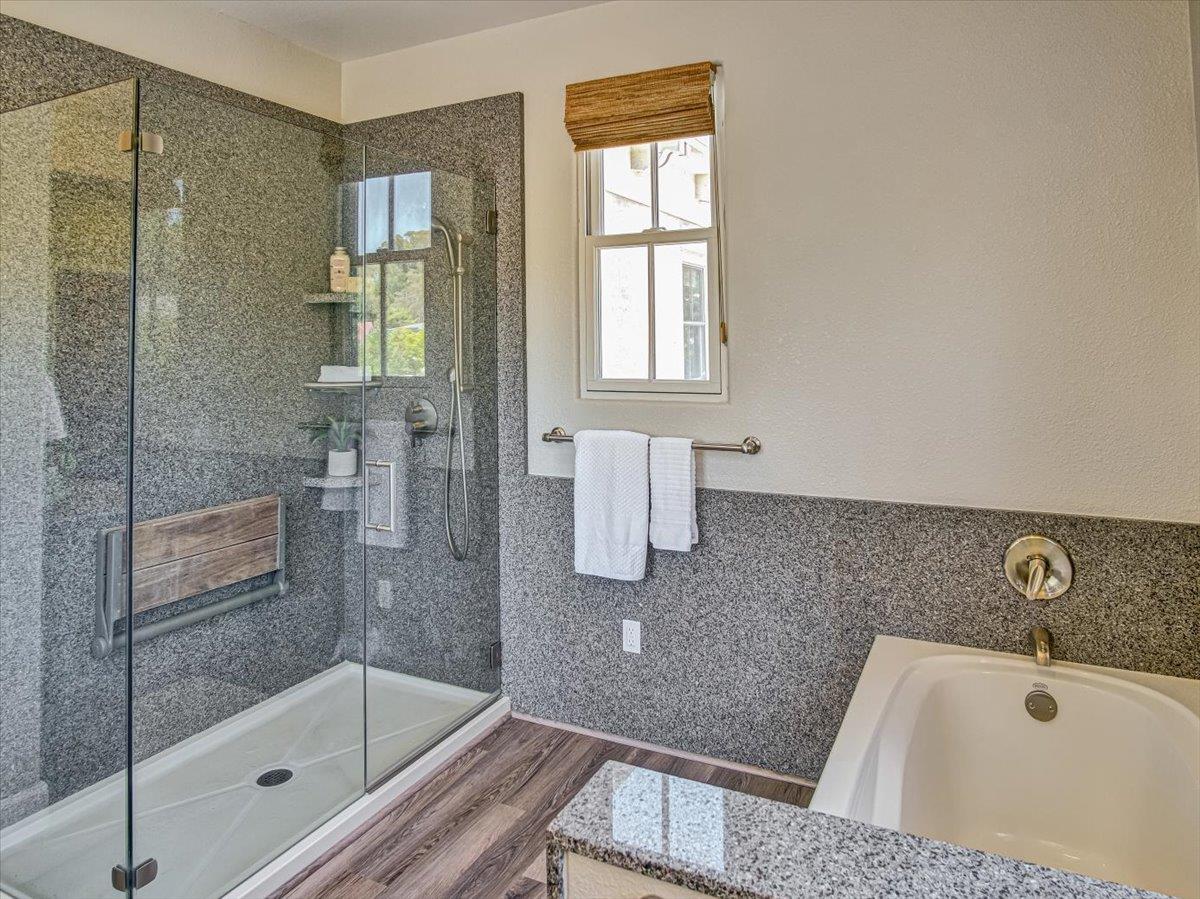 1042 Promenade Street Hercules, CA 94547 - Photo 20 of 60 a bathroom with a tub and shower
