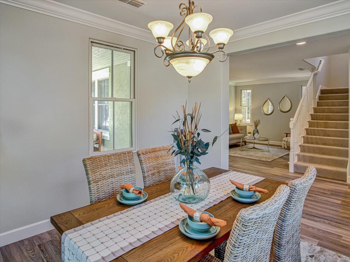 1042 Promenade Street Hercules, CA 94547 - Photo 31 of 60 a view of a dining room with furniture wooden floor and chandelier