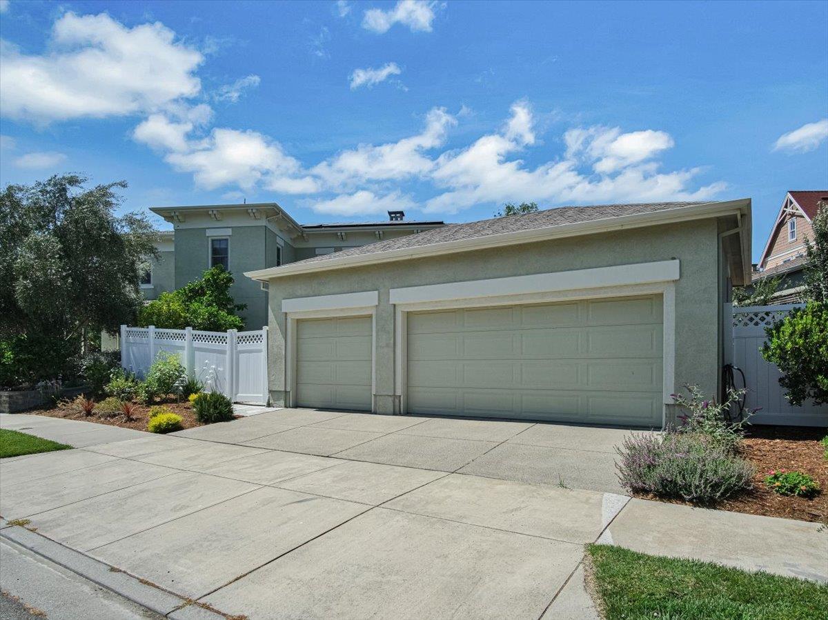 1042 Promenade Street Hercules, CA 94547 - Photo 47 of 60 a front view of a house with a yard and garage