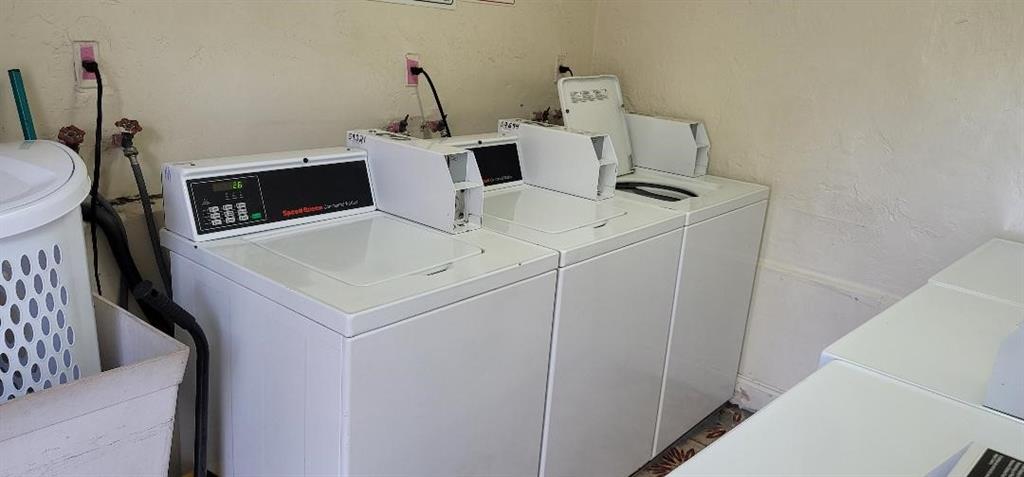 2252 Northwest 183rd Street, Unit 4 Miami Gardens, FL 33056 - Photo 13 of 15 a utility room with dryer and washer