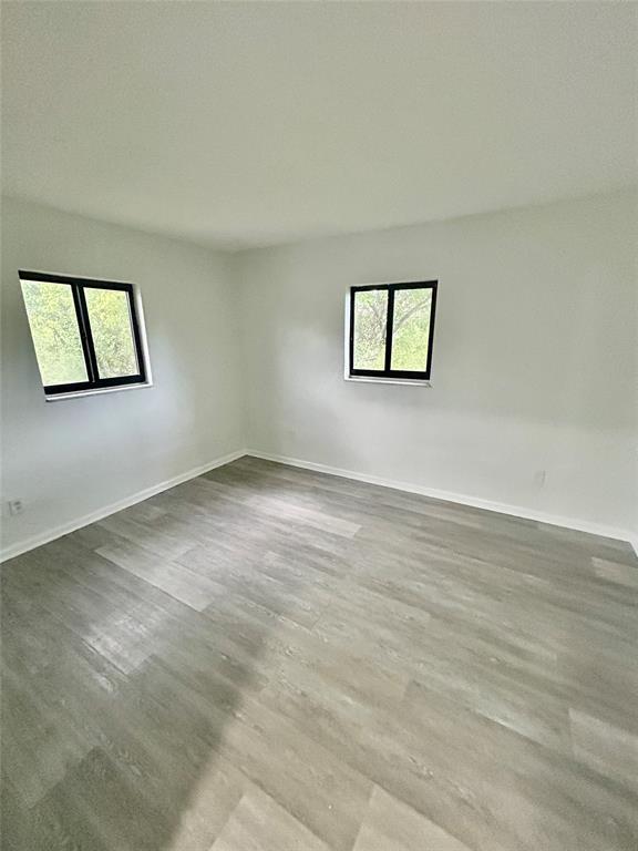 2252 Northwest 183rd Street, Unit 4 Miami Gardens, FL 33056 - Photo 8 of 15 an empty room with a window