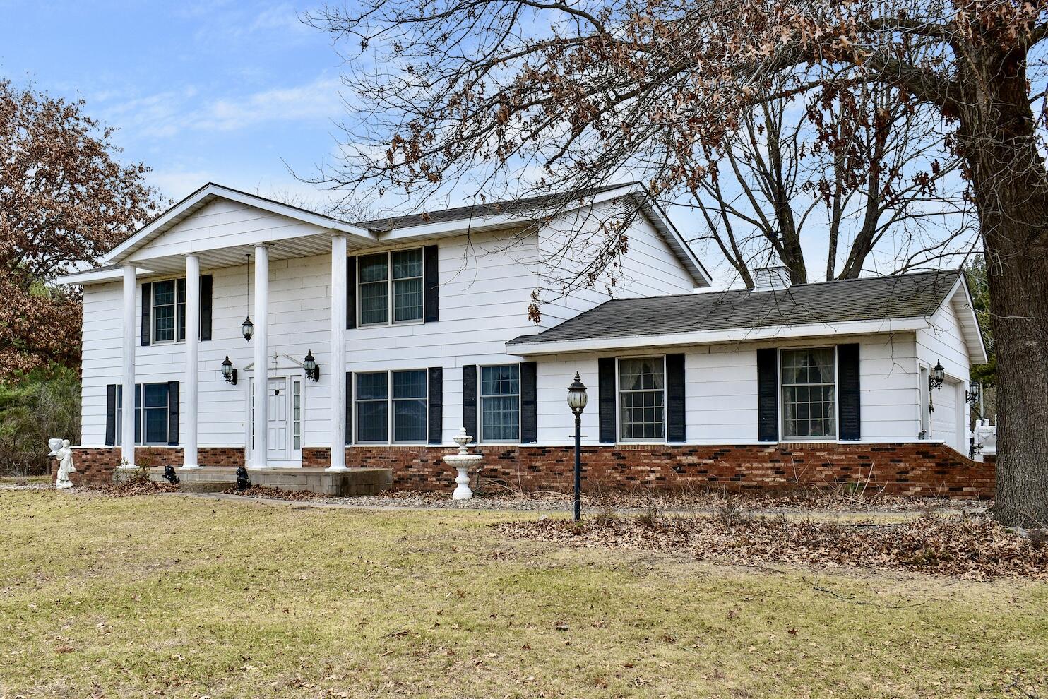 W1166 Badger Road Fountain City, WI 54629 - Photo 1 of 1 1 Front & Garage