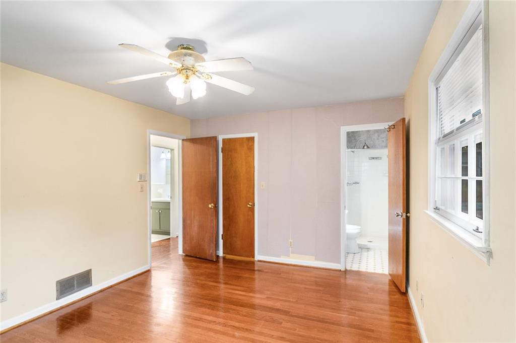 2738 Rainbow Ridge Road Decatur, GA 30034 - Photo 15 of 47 a view of an empty room with window and wooden floor