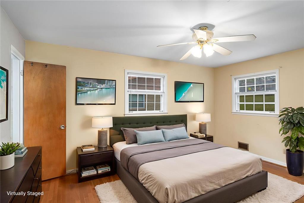 2738 Rainbow Ridge Road Decatur, GA 30034 - Photo 16 of 47 a bedroom with a bed and a chandelier