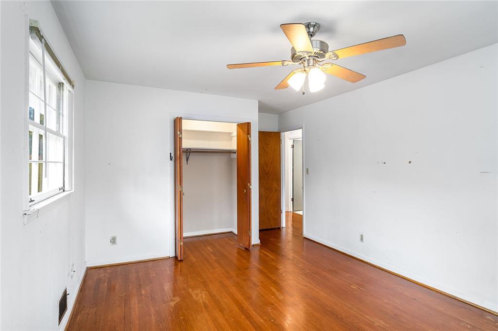 2738 Rainbow Ridge Road Decatur, GA 30034 - Photo 21 of 47 wooden floor in an empty room with a window