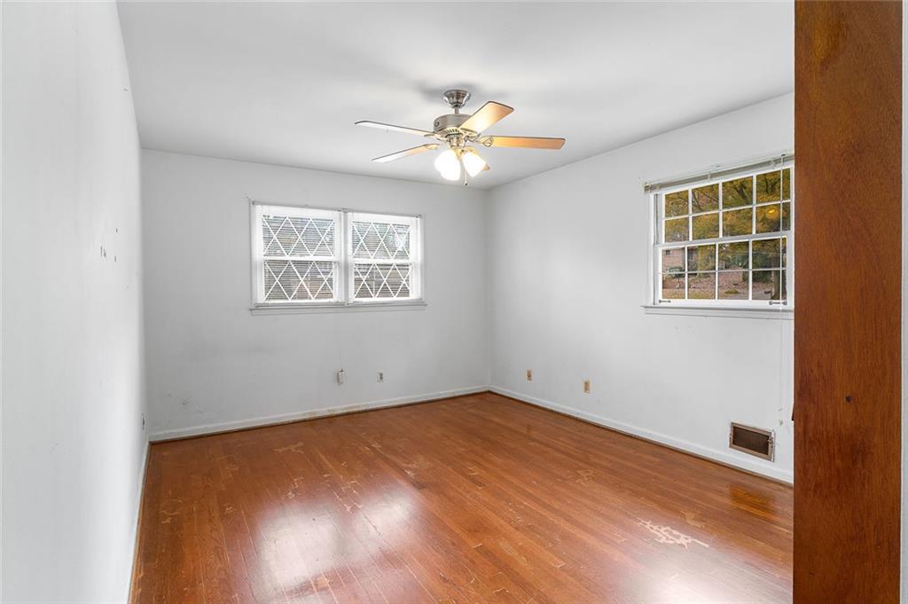 2738 Rainbow Ridge Road Decatur, GA 30034 - Photo 22 of 47 an empty room with a window and a fan