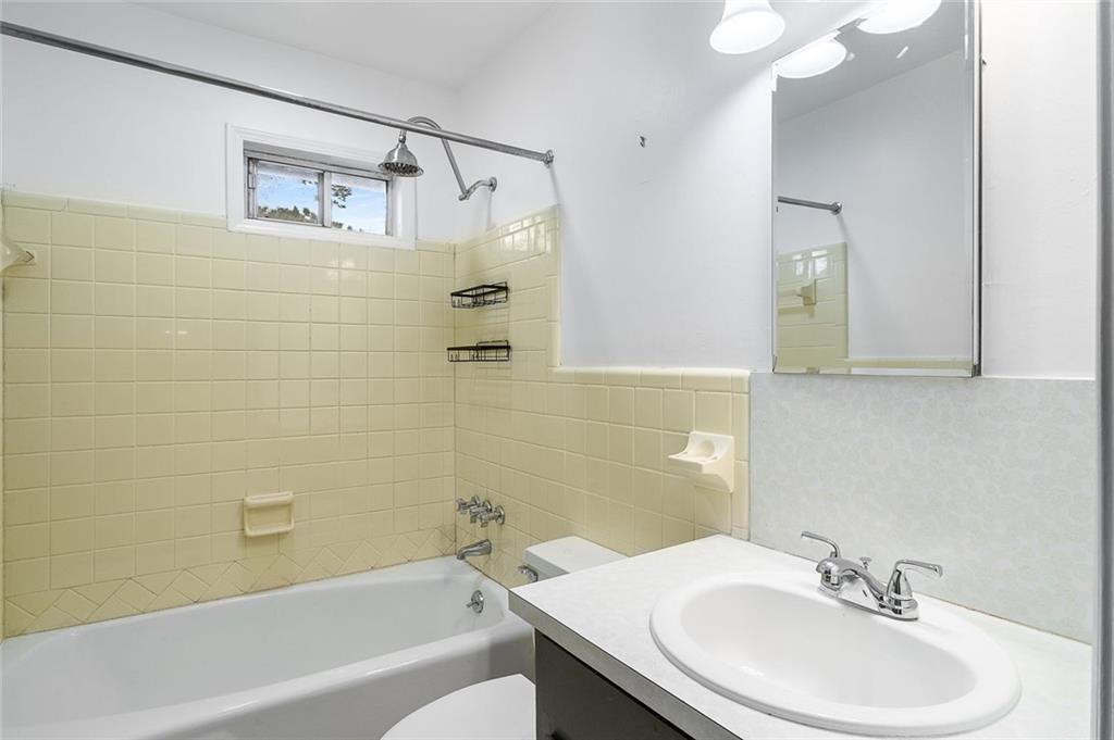 2738 Rainbow Ridge Road Decatur, GA 30034 - Photo 25 of 47 a bathroom with a sink a toilet and shower