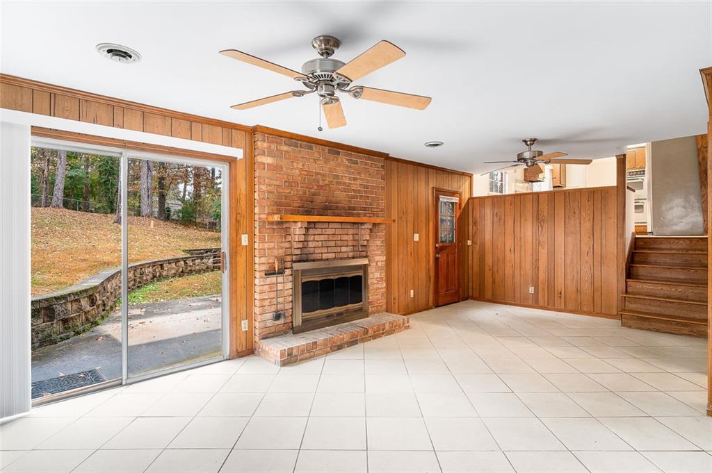 2738 Rainbow Ridge Road Decatur, GA 30034 - Photo 28 of 47 a view of an empty room with a fireplace and a window