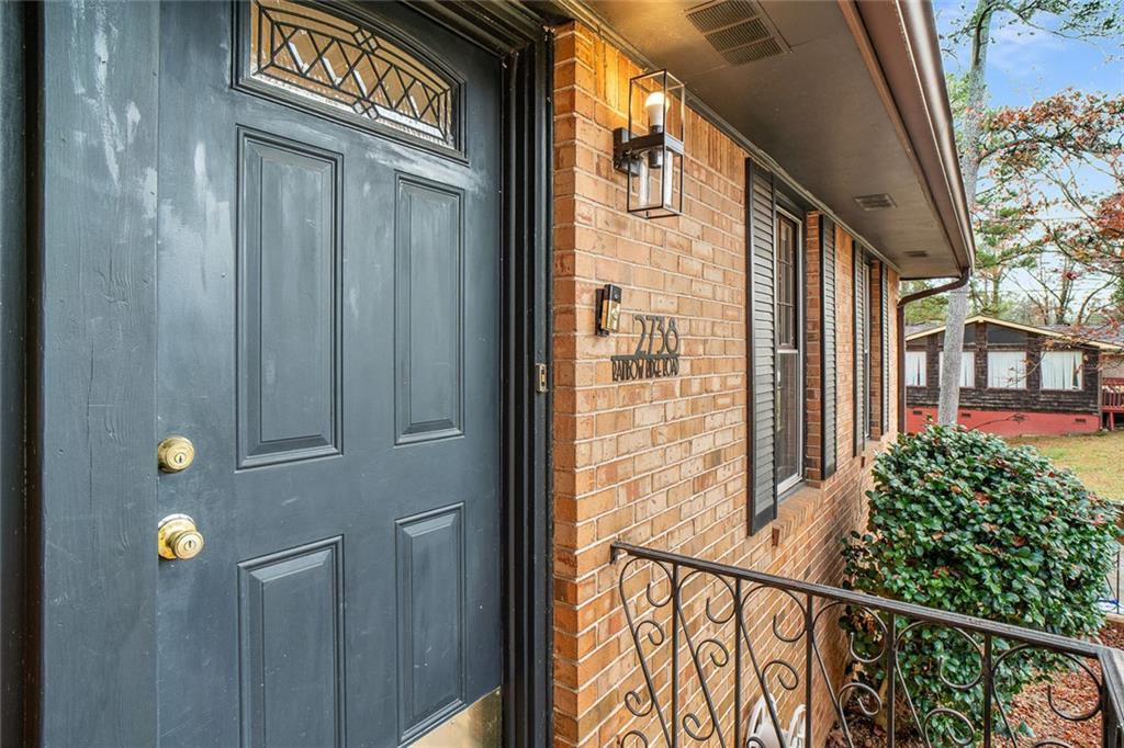 2738 Rainbow Ridge Road Decatur, GA 30034 - Photo 3 of 47 a view of a door with a street sign