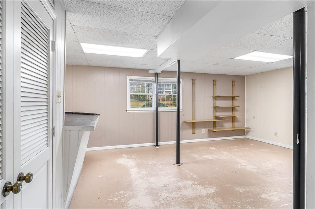2738 Rainbow Ridge Road Decatur, GA 30034 - Photo 32 of 47 a view of an empty room with a fireplace