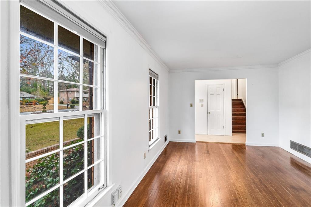 2738 Rainbow Ridge Road Decatur, GA 30034 - Photo 5 of 47 a view of empty room with wooden floor and windows