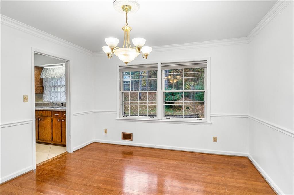 2738 Rainbow Ridge Road Decatur, GA 30034 - Photo 10 of 47 a view of an empty room with a window and wooden floor