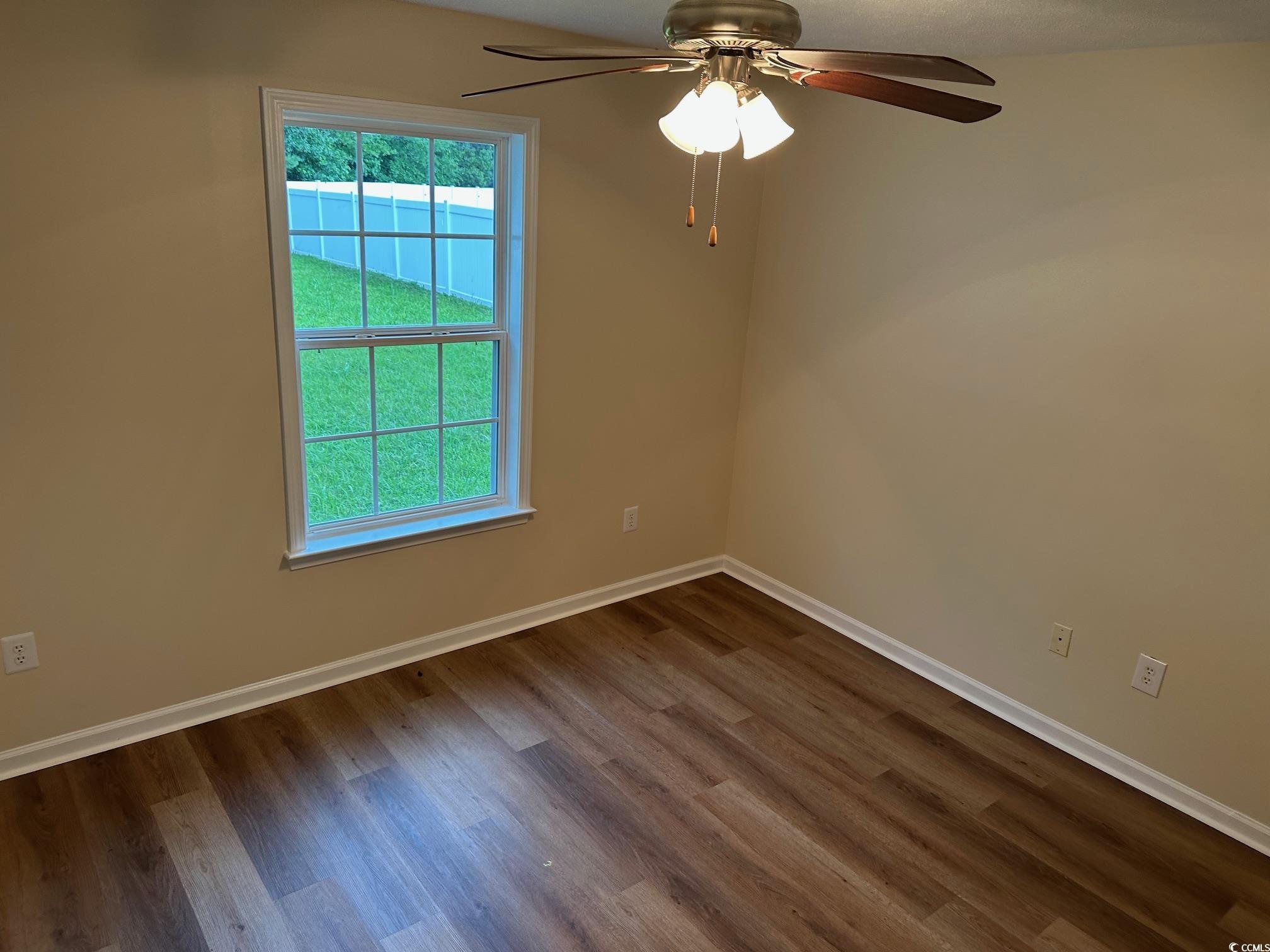 753 Bucklin Loop Myrtle Beach, SC 29579 - Photo 11 of 21 Unfurnished room featuring dark wood-type flooring