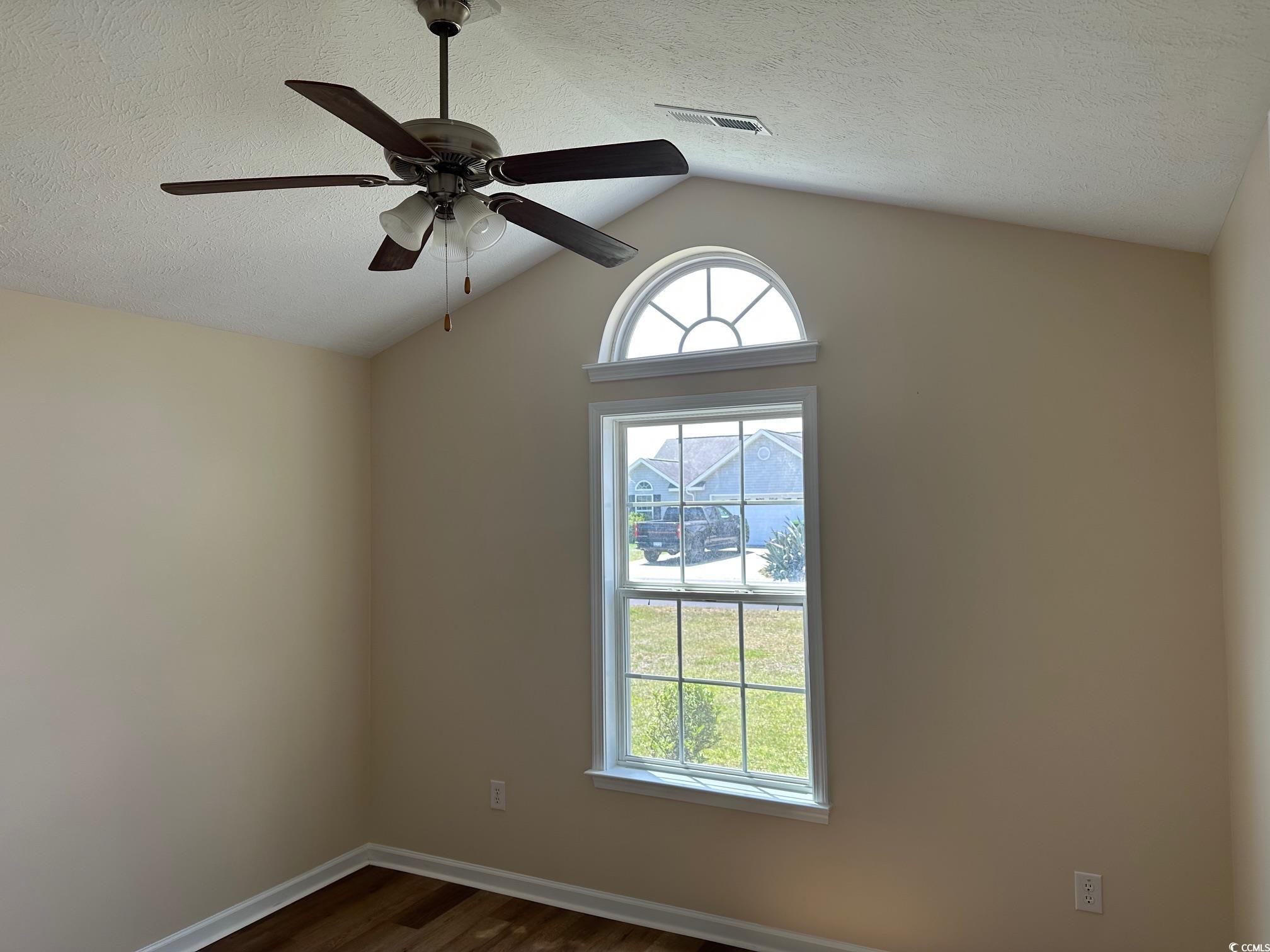 753 Bucklin Loop Myrtle Beach, SC 29579 - Photo 16 of 21 Empty room with dark wood-style floors, a textured