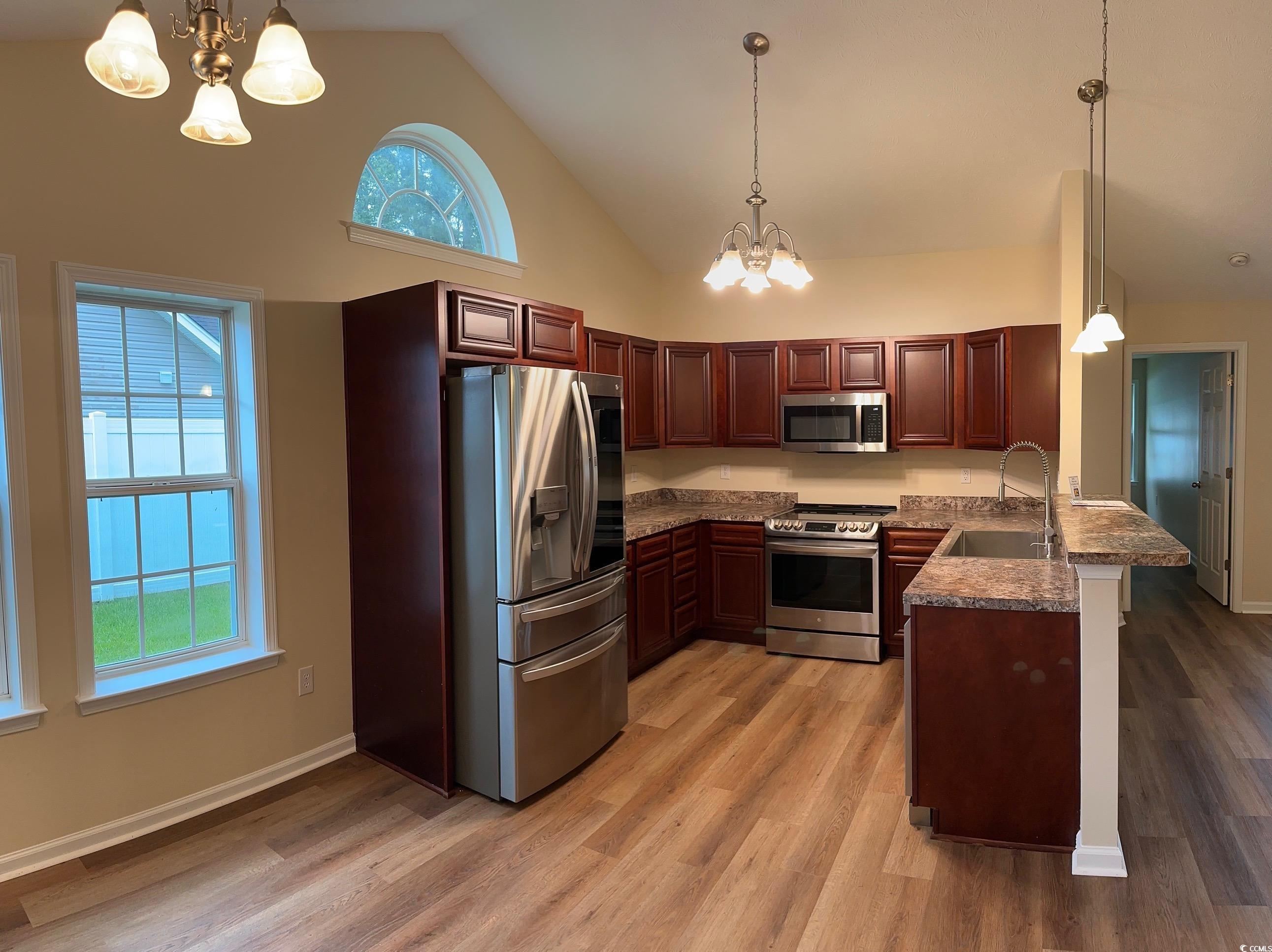 753 Bucklin Loop Myrtle Beach, SC 29579 - Photo 4 of 21 Kitchen featuring stainless steel appliances, a ch