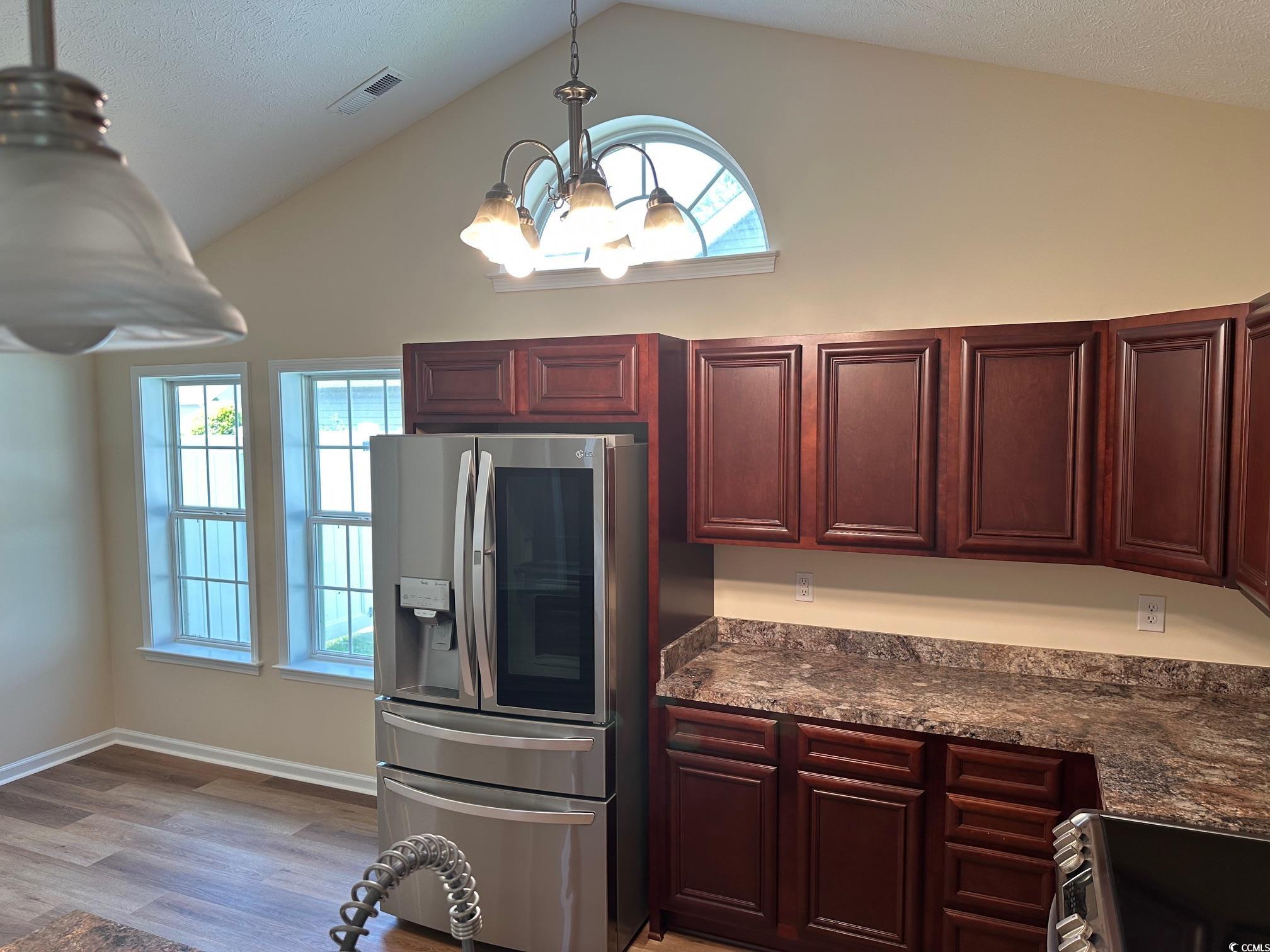 753 Bucklin Loop Myrtle Beach, SC 29579 - Photo 5 of 21 Kitchen with stainless steel fridge with ice dispe
