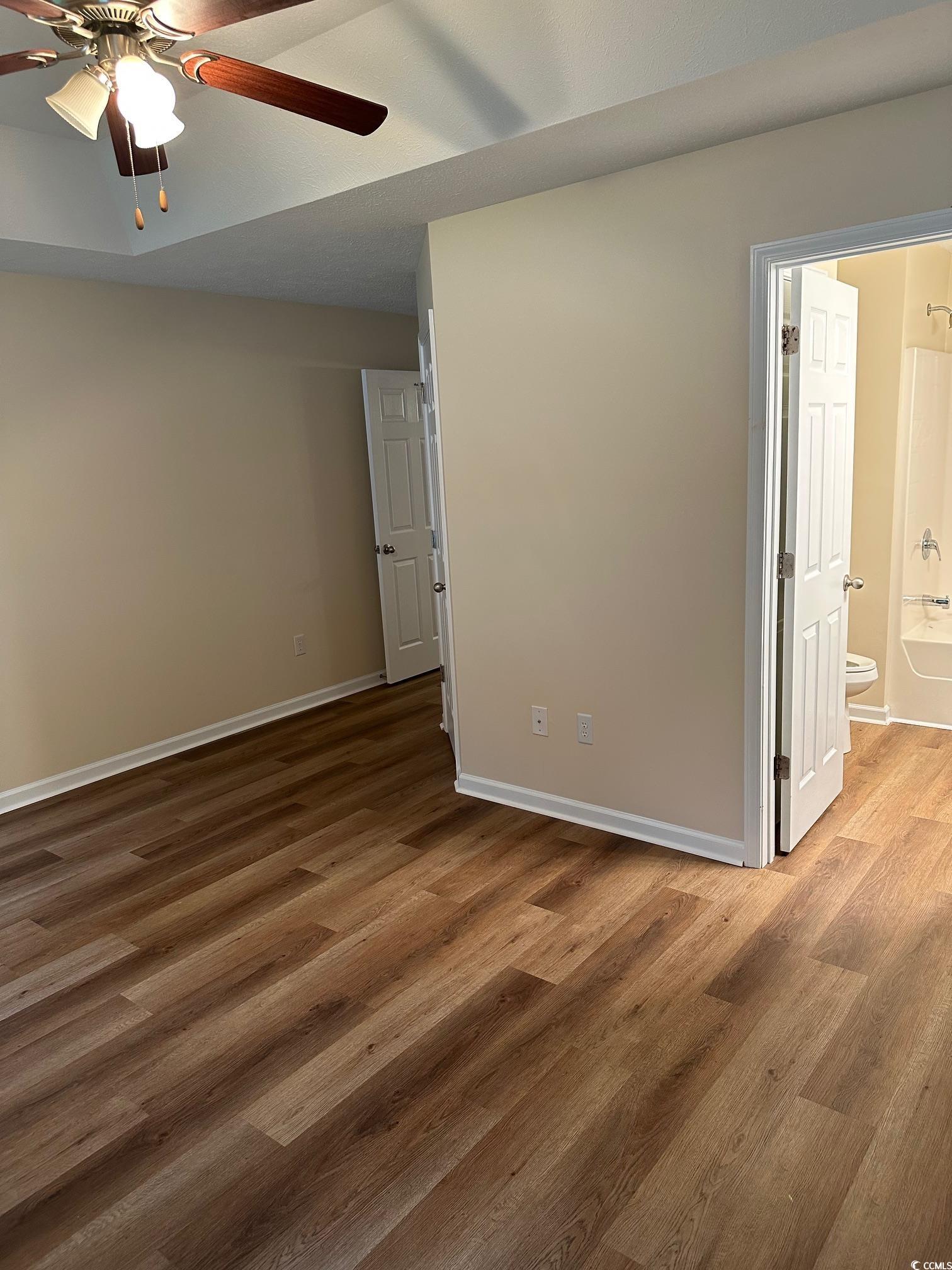 753 Bucklin Loop Myrtle Beach, SC 29579 - Photo 7 of 21 Unfurnished room featuring ceiling fan, wood finis
