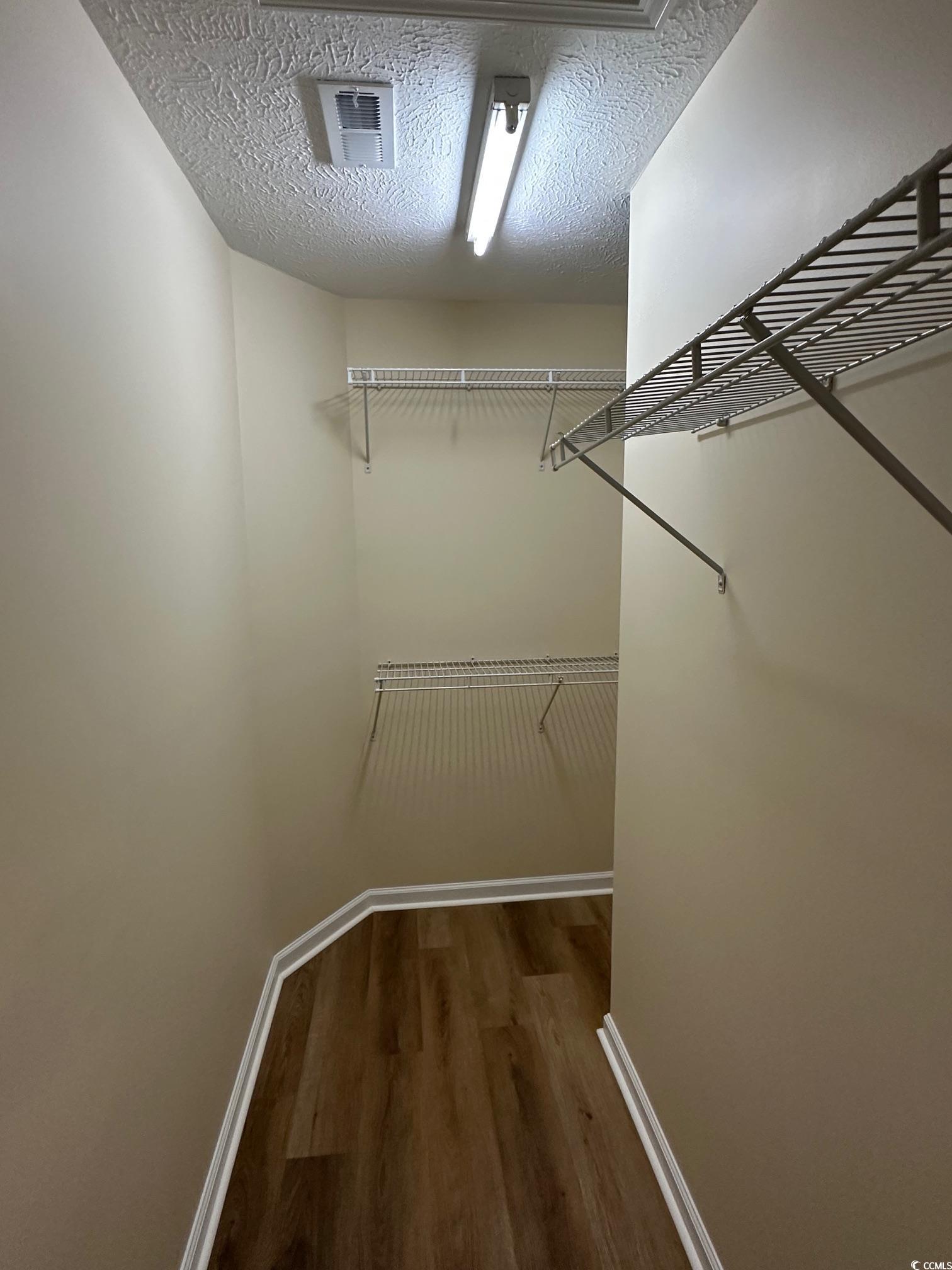 753 Bucklin Loop Myrtle Beach, SC 29579 - Photo 8 of 21 Walk in closet featuring wood finished floors