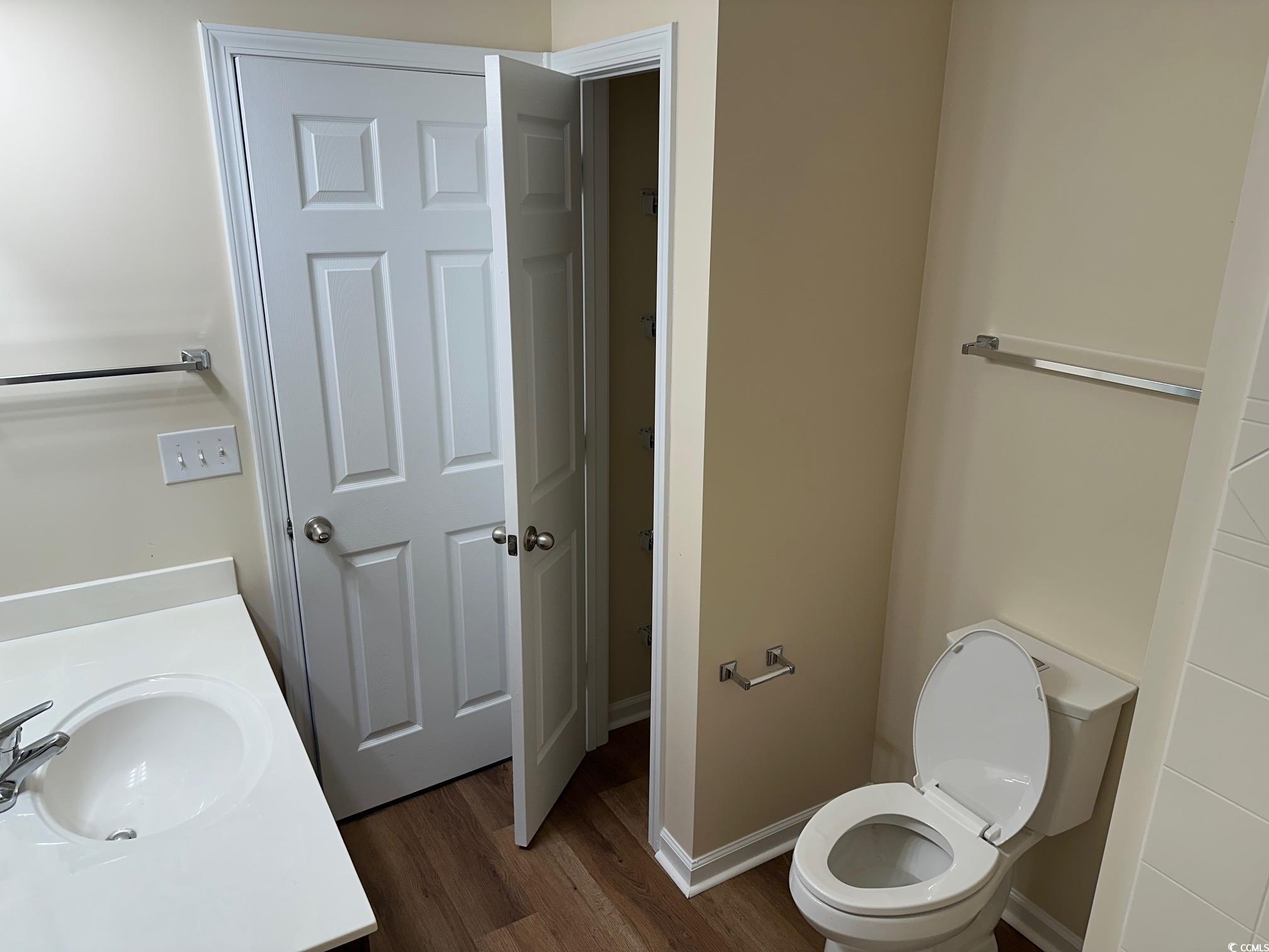 753 Bucklin Loop Myrtle Beach, SC 29579 - Photo 10 of 21 Bathroom with wood finished floors, toilet, vanity