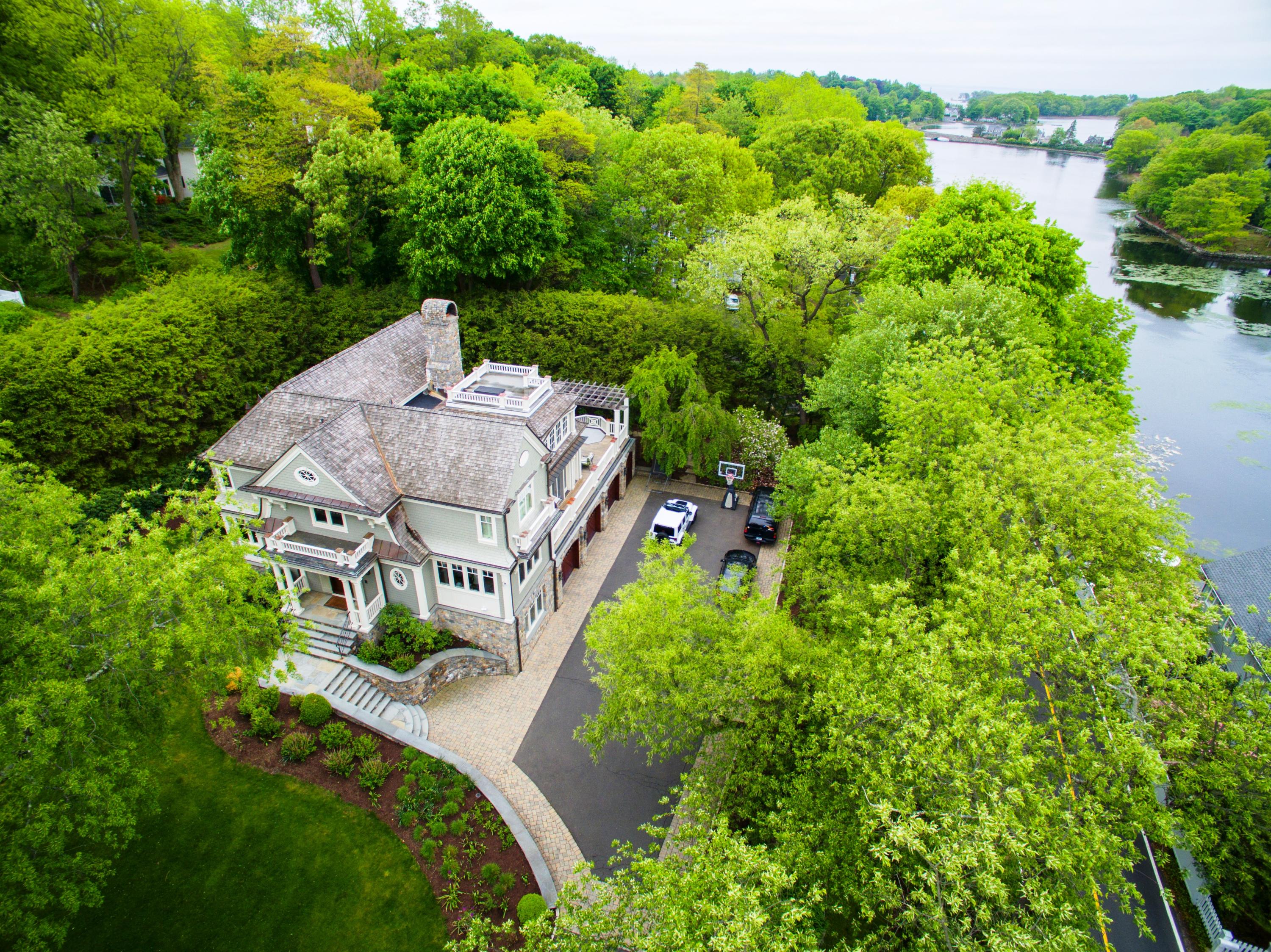 100 Goodwives River Road Darien, CT 06820 - Photo 2 of 25 an aerial view of a house with garden