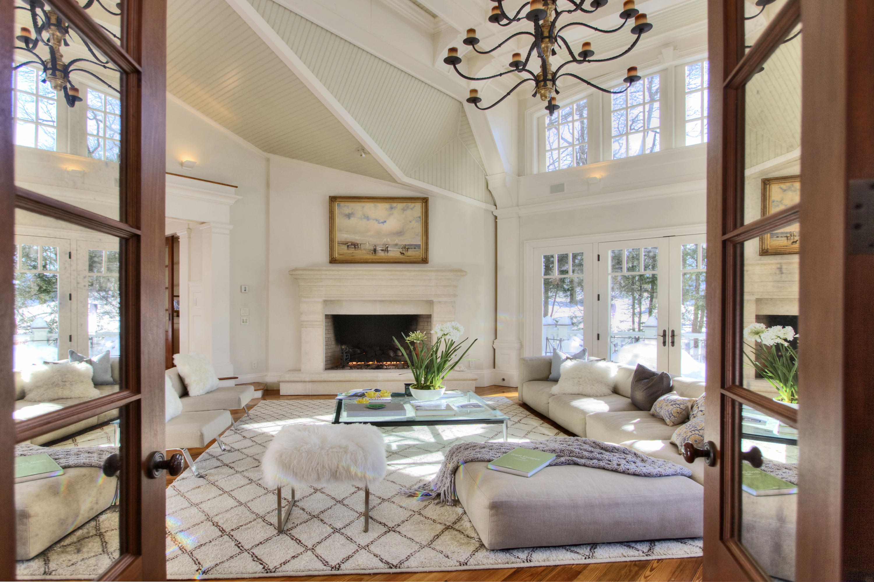 100 Goodwives River Road Darien, CT 06820 - Photo 5 of 25 a living room with furniture a large window and a fireplace