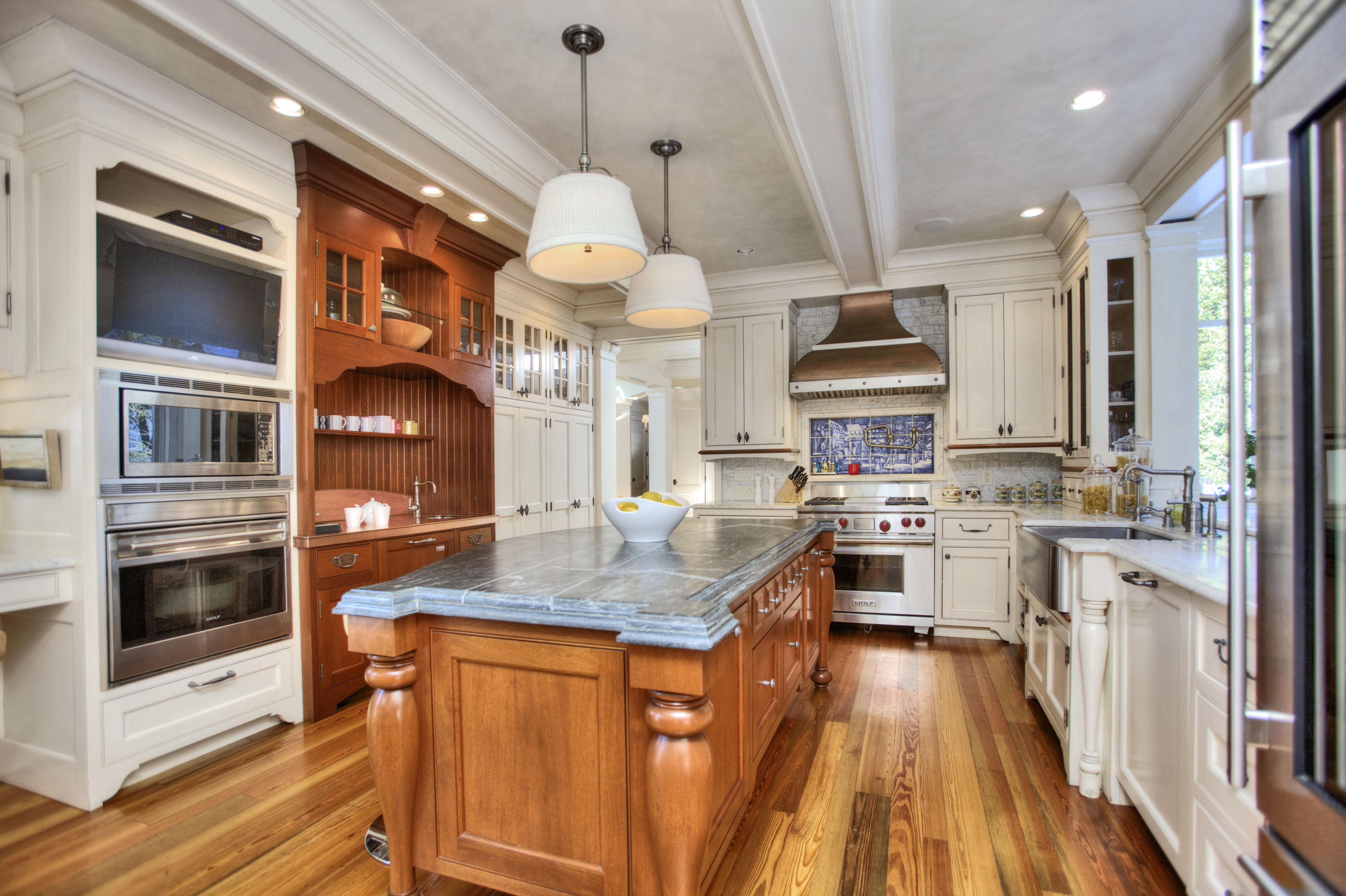 100 Goodwives River Road Darien, CT 06820 - Photo 9 of 25 a kitchen with stainless steel appliances granite countertop a stove and cabinets