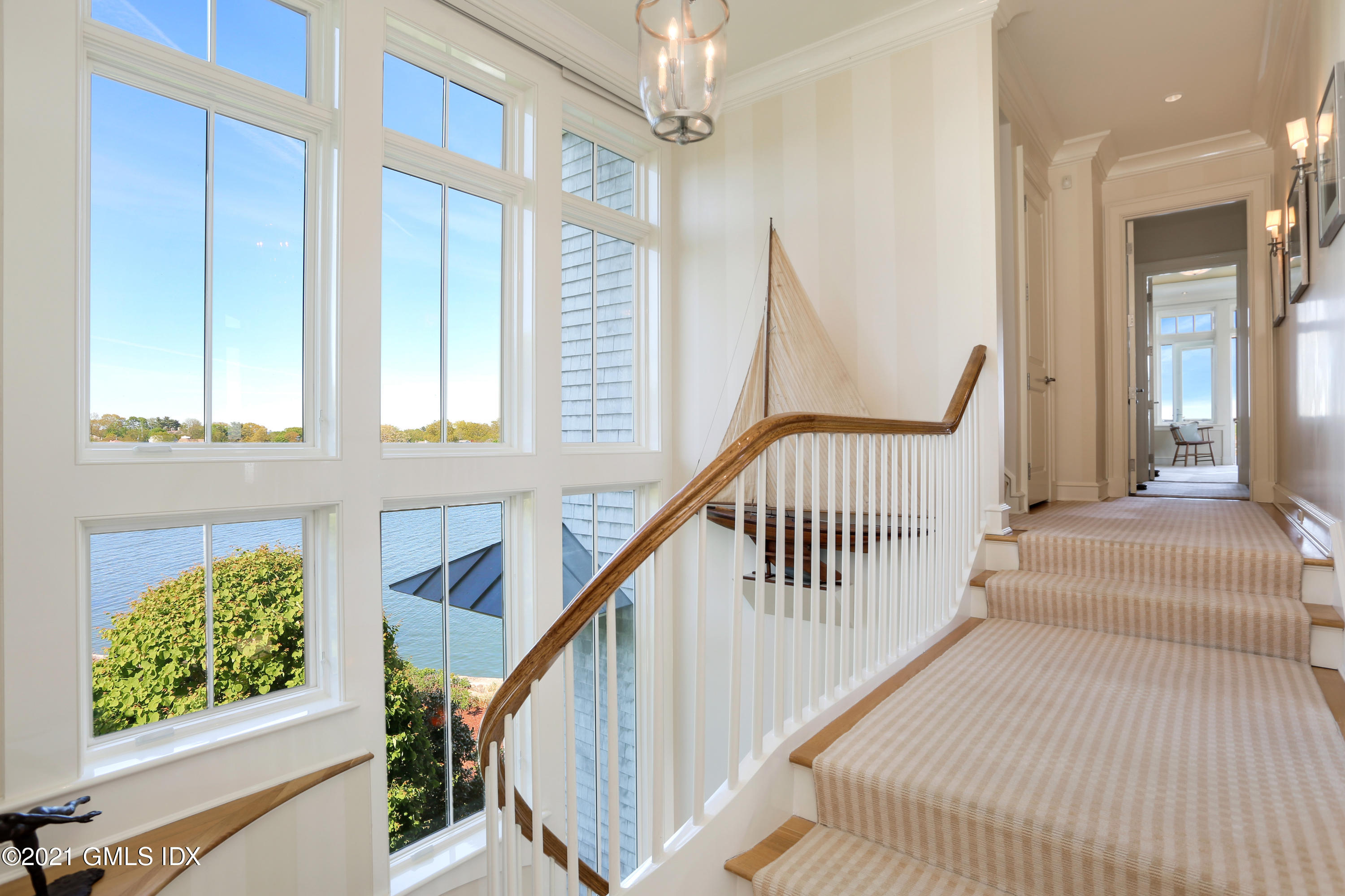 51 Willowmere Circle Riverside, CT 06878 - Photo 21 of 42 a view of a hallway with wooden floor and staircase